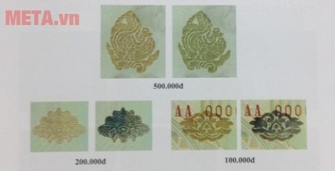 Tiền thật chao nghiêng sẽ thấy đổi màu mực ở họa tiết hoa văn.