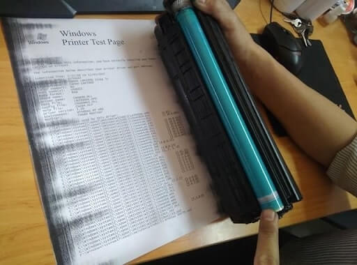 Máy in bị lem mực một bên