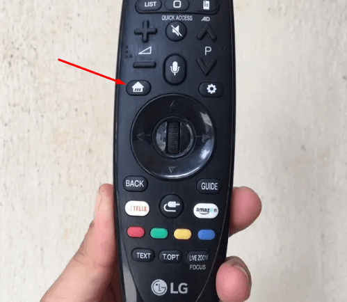 Nhấn vào nút Home trên remote tivi LG