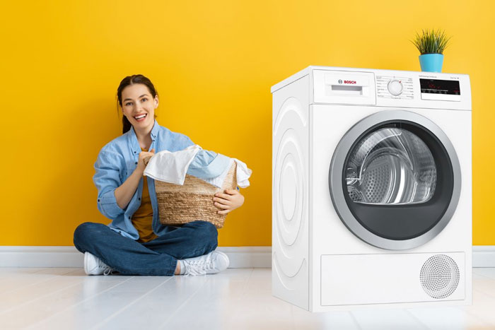 Sấy quần áo bằng máy sấy, máy giặt sấy chuyên dụng