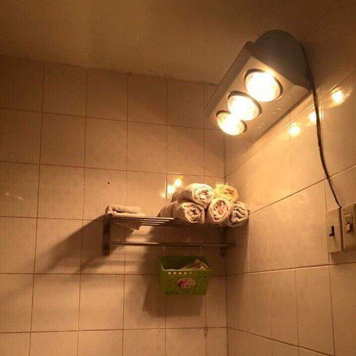 thay bóng đèn sưởi bị cháy do quá tải, sử dụng không hợp lý